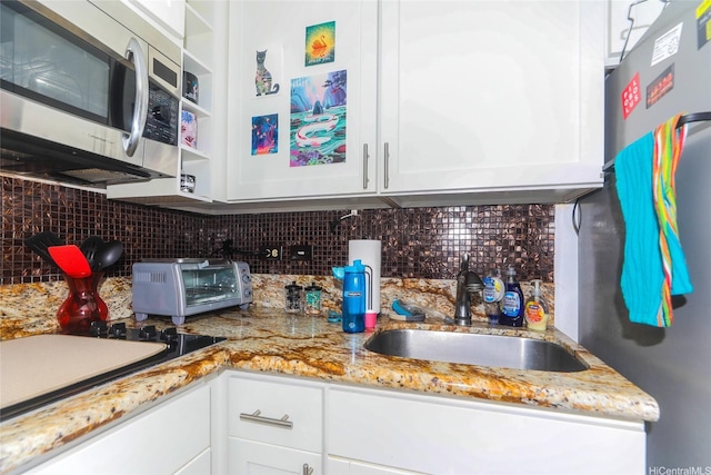 2525 Date St Unit 2303, Honolulu, HI 96826 - kitchen with appliances with stainless steel finishes, white cabinetry, and decorative backsplash