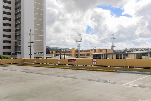 2525 Date St Unit 2303, Honolulu, HI 96826 - view of building exterior featuring uncovered parking