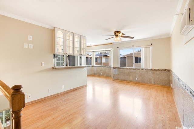 91-1026B Hoomaka St Unit 35, Ewa Beach, HI 96706 - unfurnished room featuring a ceiling fan, light wood-type flooring, ornamental molding, and wainscoting