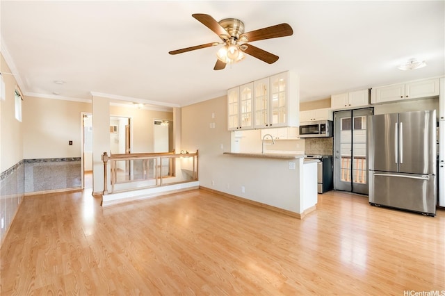 91-1026B Hoomaka St Unit 35, Ewa Beach, HI 96706 - unfurnished living room featuring ornamental molding, a ceiling fan, and light wood-style floors
