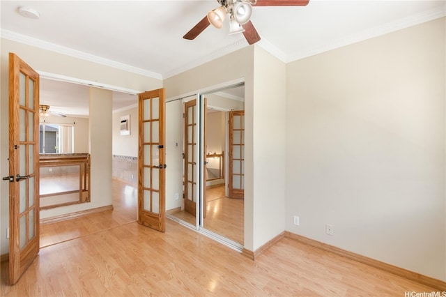 91-1026B Hoomaka St Unit 35, Ewa Beach, HI 96706 - spare room with french doors, a ceiling fan, light wood finished floors, a smoke detector, and crown molding
