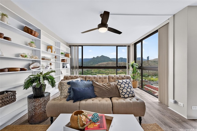 322 Aoloa St Unit 1708, Kailua, HI 96734 - living room with expansive windows, light wood-type flooring, ceiling fan, and a mountain view