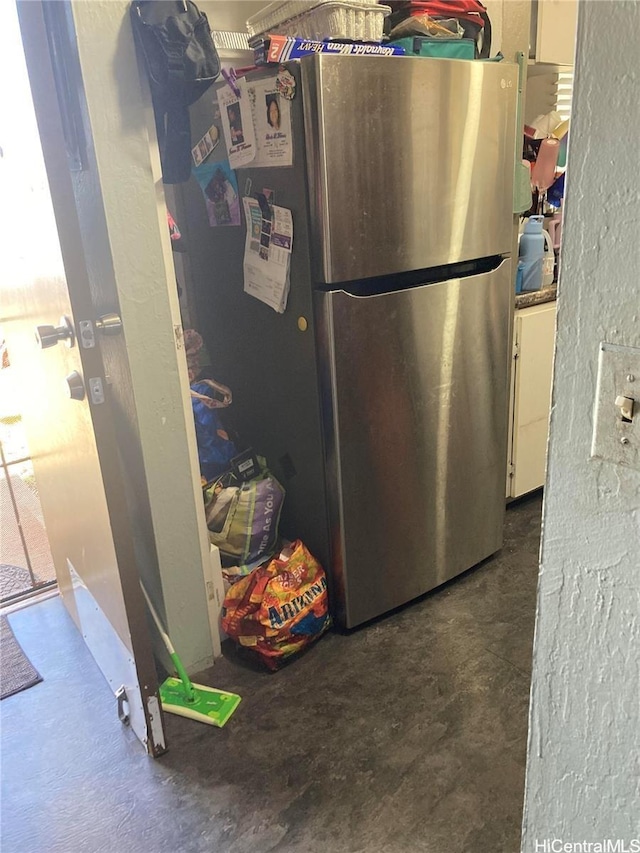 4280 Salt Lake Blvd Unit C13, Honolulu, HI 96818 - kitchen featuring freestanding refrigerator, concrete flooring, and a textured wall