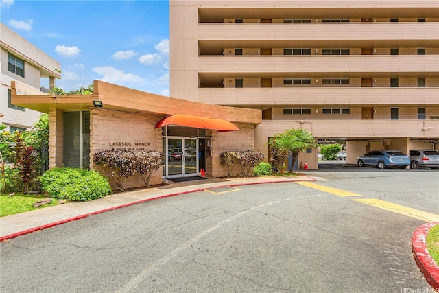 3030 Ala Ilima St Unit 402, Honolulu, HI 96818 - view of property featuring covered and uncovered parking