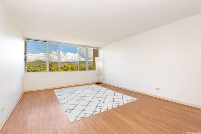 3030 Ala Ilima St Unit 402, Honolulu, HI 96818 - empty room featuring wood finished floors and baseboards