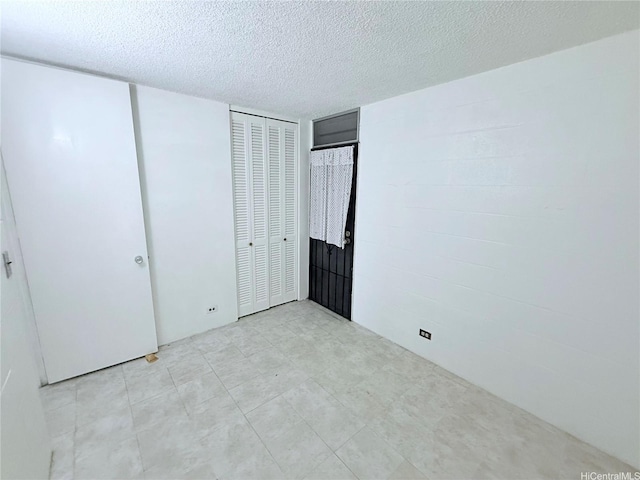 751 Kinau St Unit Dh20, Honolulu, HI 96813 - unfurnished bedroom with a textured ceiling