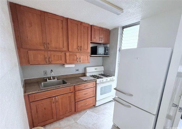 751 Kinau St Unit Dh20, Honolulu, HI 96813 - kitchen with white appliances, brown cabinetry, and a textured ceiling