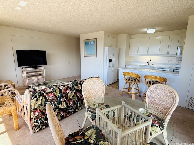 1778 Ala Moana Blvd Unit 2816, Honolulu, HI 96815 - living area featuring light colored carpet and a textured ceiling