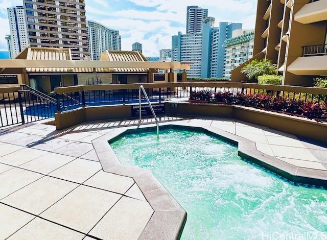 1778 Ala Moana Blvd Unit 2816, Honolulu, HI 96815 - view of pool with a swimming pool, a view of city, and a patio