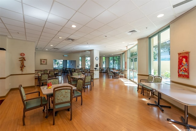 1314 Kalakaua Ave Unit 1407, Honolulu, HI 96826 - dining room with plenty of natural light, light wood-style floors, and a paneled ceiling