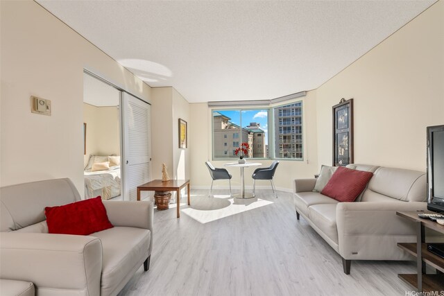 1314 Kalakaua Ave Unit 1407, Honolulu, HI 96826 - living room featuring light wood finished floors and baseboards