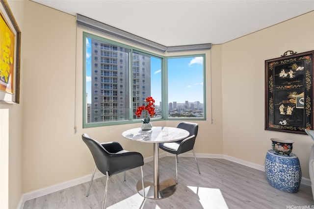 1314 Kalakaua Ave Unit 1407, Honolulu, HI 96826 - dining room with wood finished floors and a city view