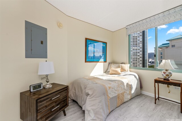1314 Kalakaua Ave Unit 1407, Honolulu, HI 96826 - bedroom featuring electric panel and wood finished floors