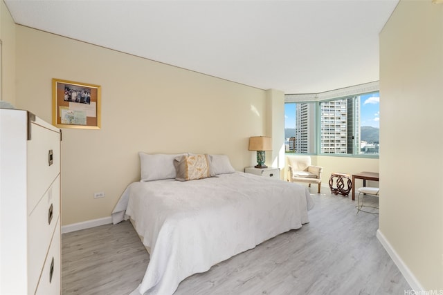 1314 Kalakaua Ave Unit 1407, Honolulu, HI 96826 - bedroom with light wood-type flooring and baseboards