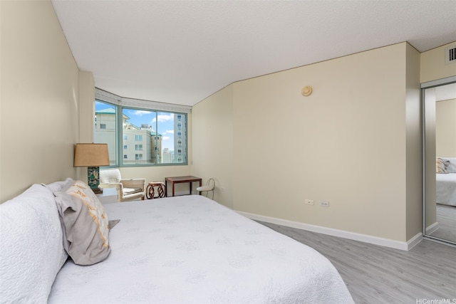 1314 Kalakaua Ave Unit 1407, Honolulu, HI 96826 - bedroom featuring wood finished floors and baseboards