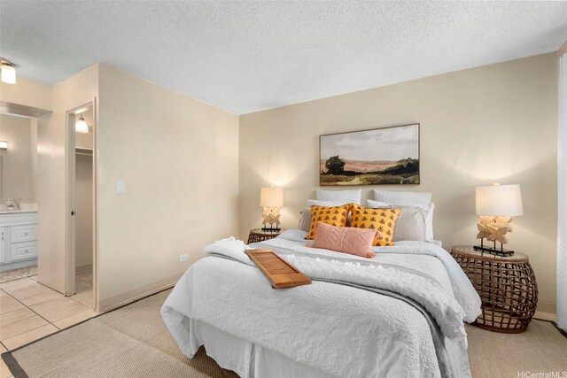 98-1038 Moanalua Rd Unit 1502, Aiea, HI 96701 - bedroom with a textured ceiling, connected bathroom, and light tile patterned floors