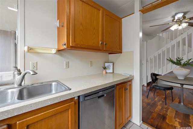 95-45 Hokuiwa St Unit 22, Mililani, HI 96789 - kitchen featuring stainless steel dishwasher, light countertops, a ceiling fan, and brown cabinets