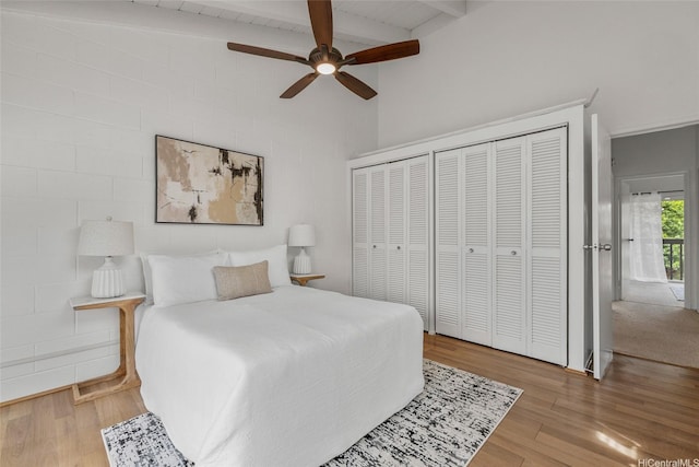95-45 Hokuiwa St Unit 22, Mililani, HI 96789 - bedroom with wood finished floors, beamed ceiling, ceiling fan, and two closets