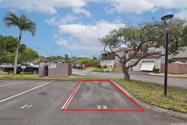 95-45 Hokuiwa St Unit 22, Mililani, HI 96789 - uncovered parking lot featuring a residential view