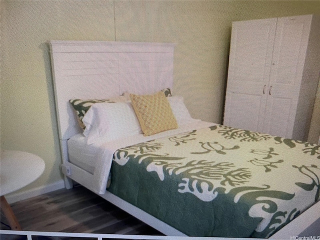 2450 Koa Ave Unit 35, Honolulu, HI 96815 - bedroom featuring wood finished floors and baseboards