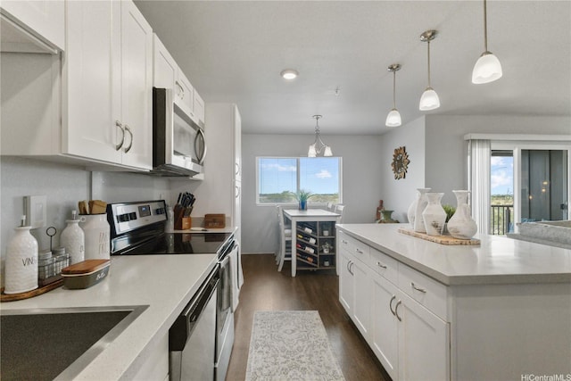91-3475 Nana Hope St Unit 601, Ewa Beach, HI 96706 - kitchen featuring stainless steel appliances, dark wood-style floors, plenty of natural light, light countertops, and recessed lighting