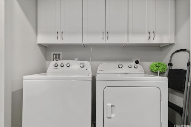 91-3475 Nana Hope St Unit 601, Ewa Beach, HI 96706 - laundry area with washer and clothes dryer and cabinet space