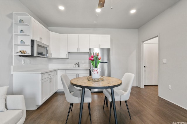 91-3475 Nana Hope St Unit 601, Ewa Beach, HI 96706 - kitchen with appliances with stainless steel finishes, open shelves, white cabinets, dark wood-style floors, and recessed lighting