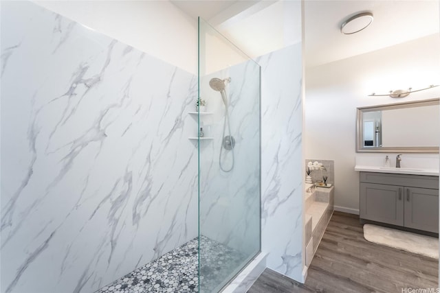 5216 Hao Pl, Honolulu, HI 96821 - full bath featuring vanity, a bath, a marble finish shower, and wood finished floors