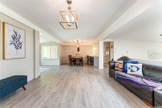 5216 Hao Pl, Honolulu, HI 96821 - living room featuring a chandelier and wood finished floors