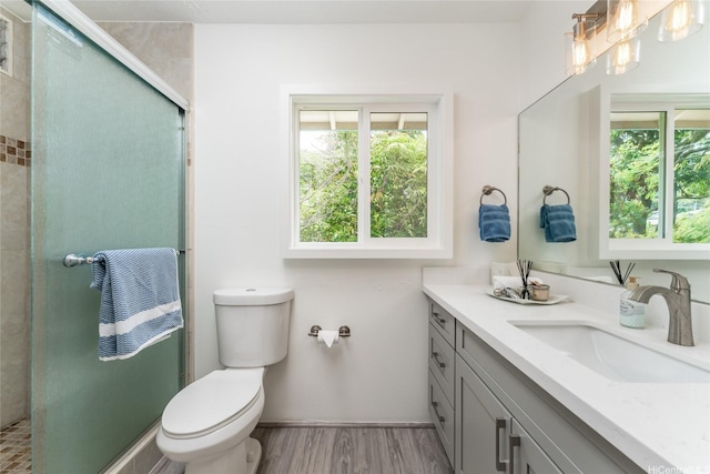 5216 Hao Pl, Honolulu, HI 96821 - bathroom featuring vanity, a stall shower, and wood finished floors