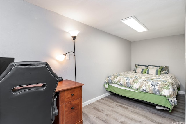 5216 Hao Pl, Honolulu, HI 96821 - bedroom with light wood-style floors and a desk