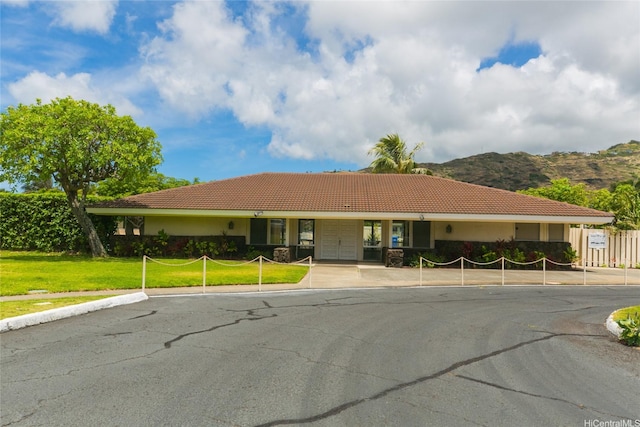 753 Kalanipuu St, Honolulu, HI 96825 - ranch-style home with a tiled roof, a mountain view, and stucco siding
