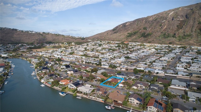753 Kalanipuu St, Honolulu, HI 96825 - aerial view of property and surrounding area featuring nearby suburban area, property parcel outlined, and a water and mountain view