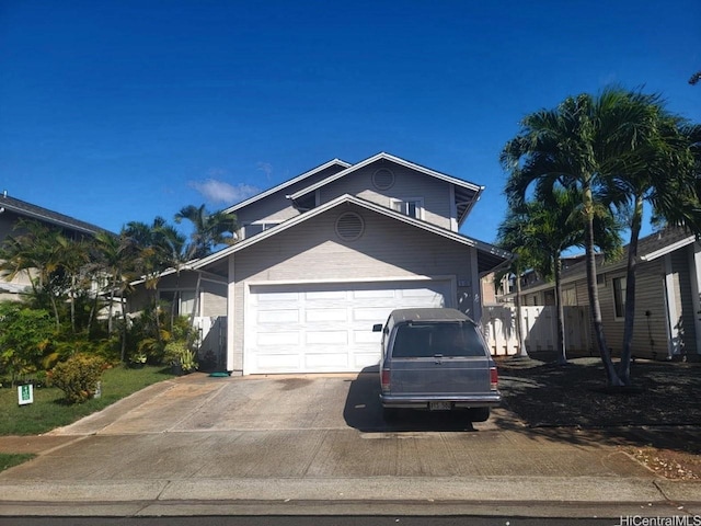 91-1197 Kamoawa St, Ewa Beach, HI 96706 - view of front of house with driveway and an attached garage