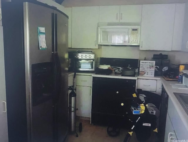 91-1197 Kamoawa St, Ewa Beach, HI 96706 - kitchen featuring white microwave, stainless steel fridge, an office area, light countertops, and white cabinetry