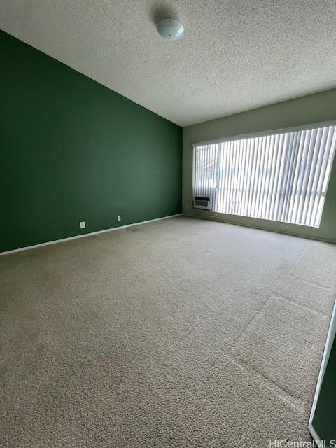 91-1020 Laaulu St Unit 27C, Ewa Beach, HI 96706 - carpeted spare room featuring a textured ceiling