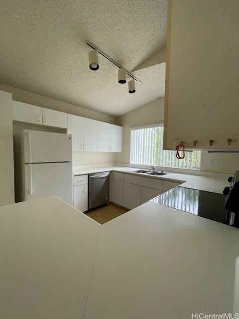 91-1020 Laaulu St Unit 27C, Ewa Beach, HI 96706 - kitchen featuring freestanding refrigerator, dishwasher, a textured ceiling, white cabinets, and track lighting