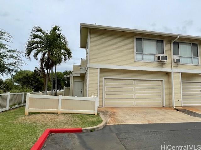 91-1020 Laaulu St Unit 27C, Ewa Beach, HI 96706 - view of front of property with a garage, cooling unit, and driveway