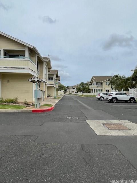 91-1020 Laaulu St Unit 27C, Ewa Beach, HI 96706 - view of asphalt road featuring a residential view and curbs