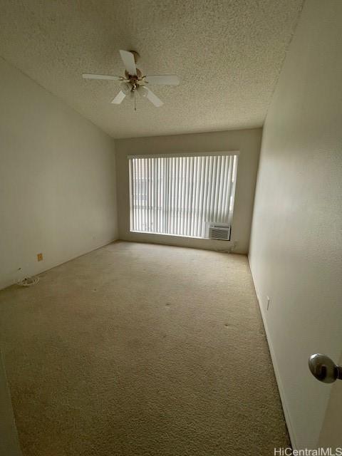 91-1020 Laaulu St Unit 27C, Ewa Beach, HI 96706 - carpeted empty room featuring a textured ceiling and ceiling fan