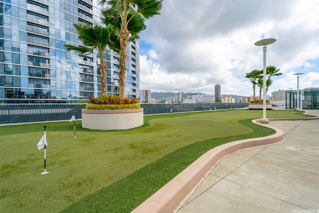 1296 Kapiolani Blvd Unit Ii-1801, Honolulu, HI 96814 - view of home's community featuring a putting green and a city view