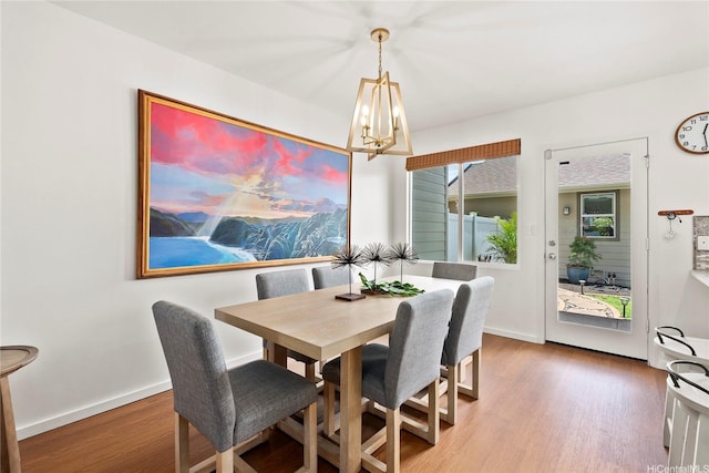 91-1312 Keoneula Blvd Unit 203, Ewa Beach, HI 96706 - dining room featuring a chandelier and wood finished floors
