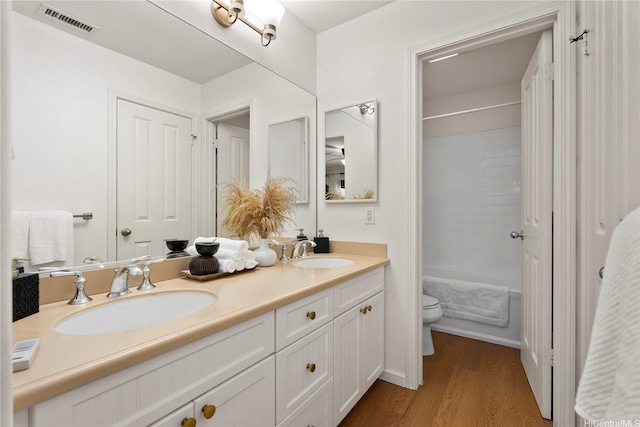 91-1312 Keoneula Blvd Unit 203, Ewa Beach, HI 96706 - full bathroom with double vanity, wood finished floors, and shower / bath combination