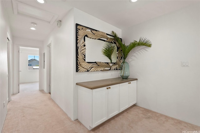 91-1312 Keoneula Blvd Unit 203, Ewa Beach, HI 96706 - hall featuring light colored carpet, attic access, and recessed lighting