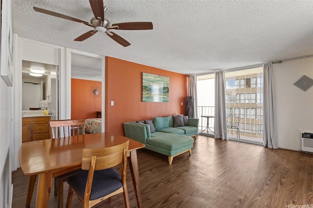 364 Seaside Ave Unit 1211, Honolulu, HI 96815 - living room featuring a textured ceiling, a wall of windows, ceiling fan, and wood finished floors