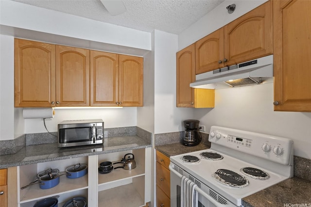 364 Seaside Ave Unit 1211, Honolulu, HI 96815 - kitchen featuring electric stove, under cabinet range hood, stainless steel microwave, a textured ceiling, and dark stone counters