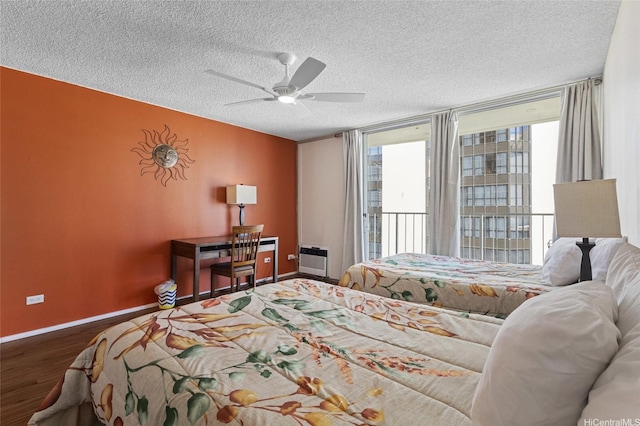 364 Seaside Ave Unit 1211, Honolulu, HI 96815 - bedroom with wood finished floors, a textured ceiling, a ceiling fan, and access to exterior