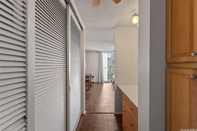 364 Seaside Ave Unit 1211, Honolulu, HI 96815 - hall featuring a textured ceiling and dark wood-style flooring