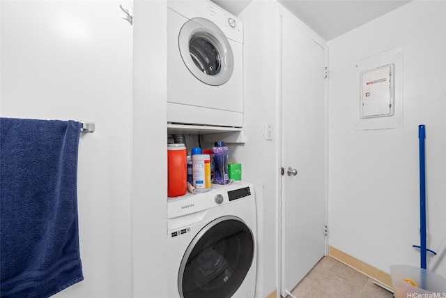 98-402 Koauka Loop Unit 216, Aiea, HI 96701 - laundry area featuring stacked washer / dryer, light tile patterned flooring, and electric panel