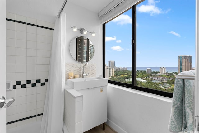 444 Niu St Unit 2403, Honolulu, HI 96815 - full bath featuring vanity, a city view, and shower / bathtub combination with curtain